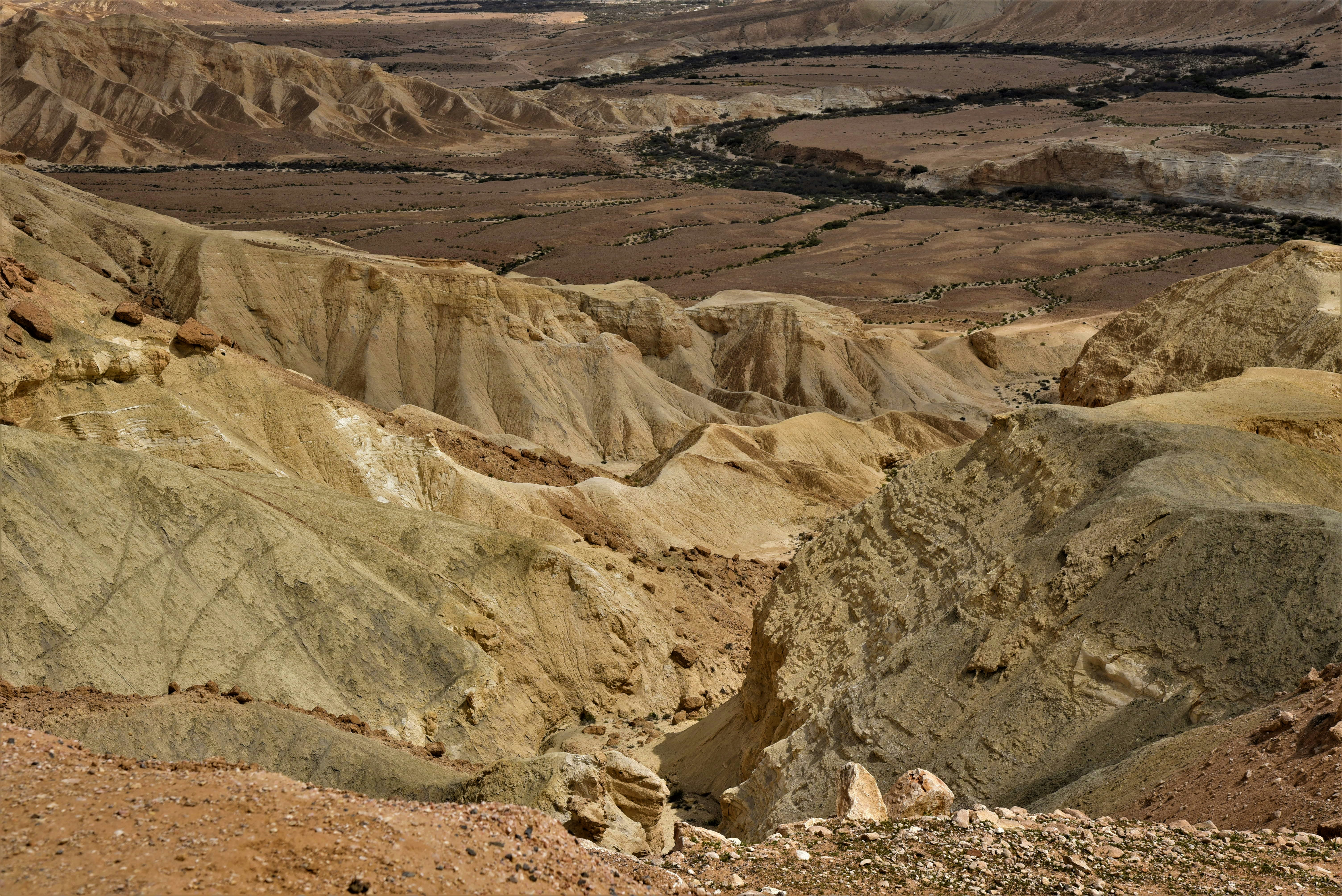 a rocky canyon with a river running through it