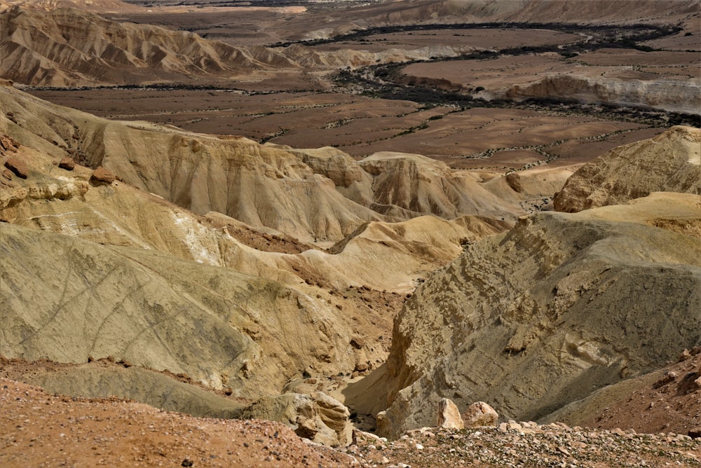 a rocky canyon with a river running through it