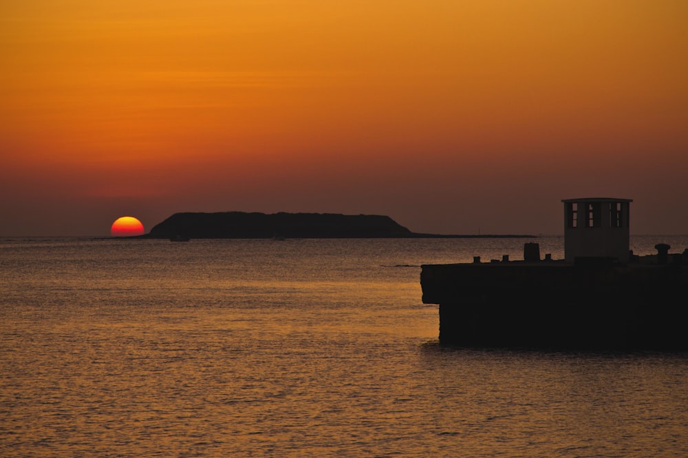 a sunset over a body of water