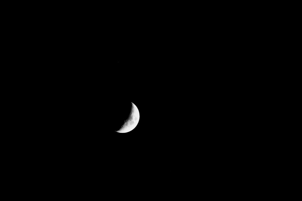 a half moon in a black sky