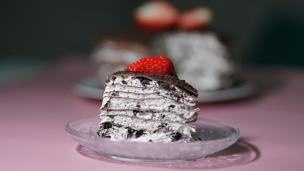a stack of chocolate cake with a strawberry on top