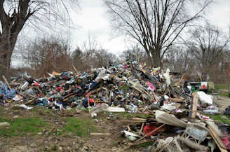 a pile of trash in a yard