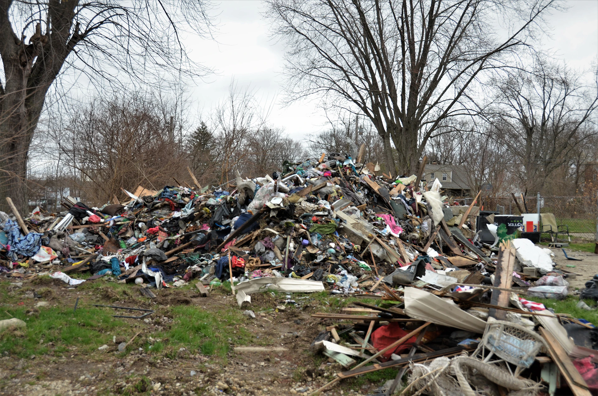 a pile of trash in a yard