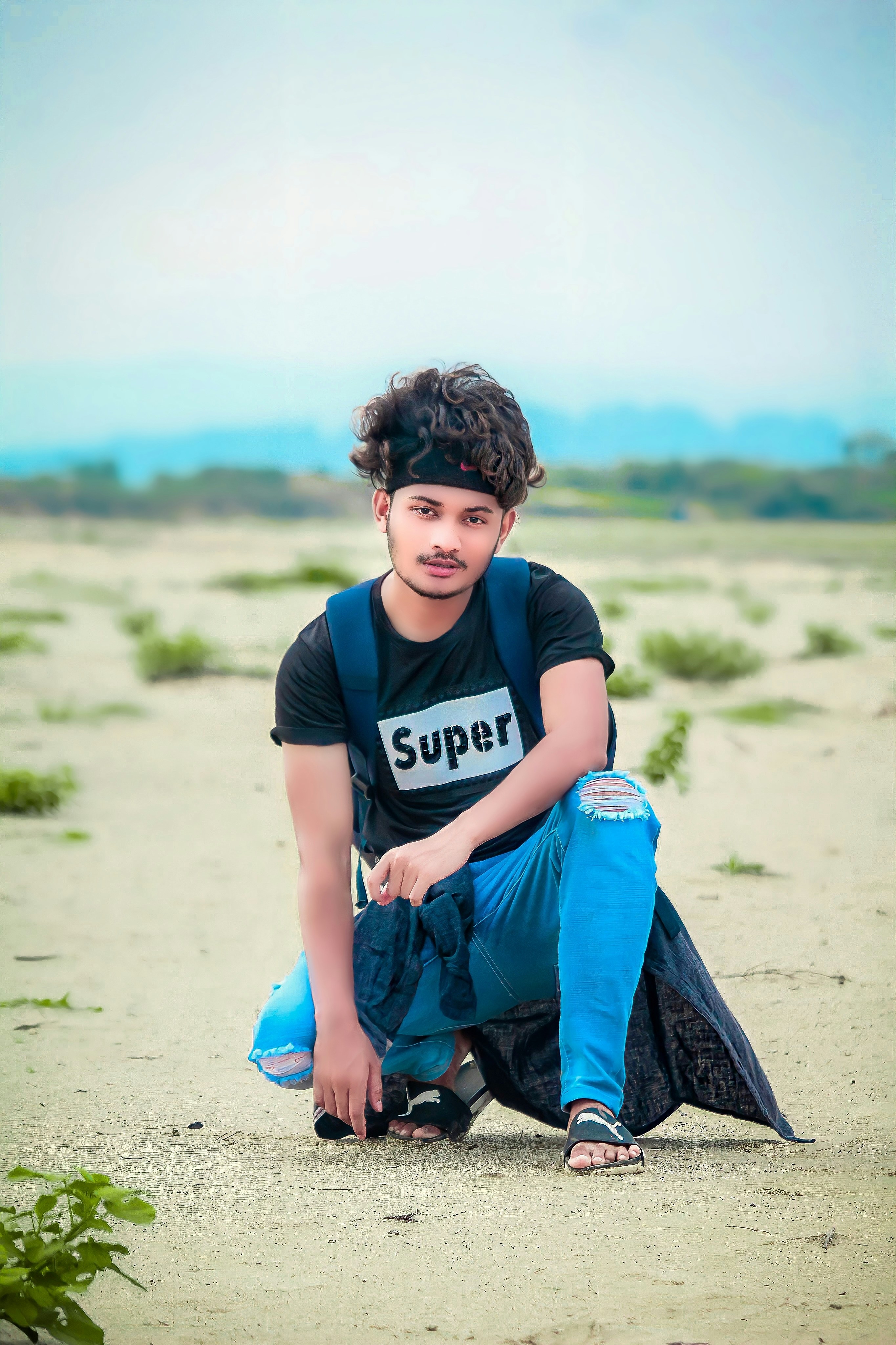 a person sitting on the sand