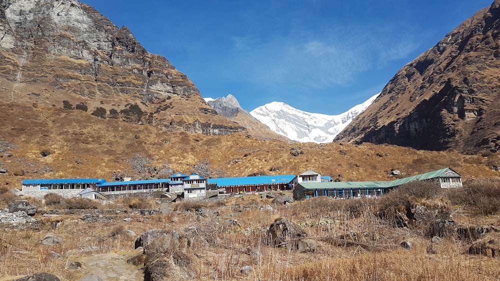 a train going through a valley between mountains