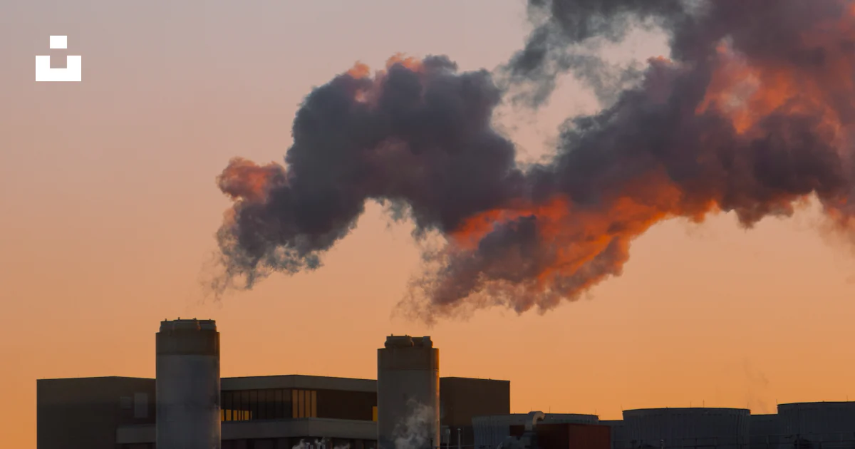 Polluted Building A building with smoke coming out of it photo – Free Pollution Image on ...