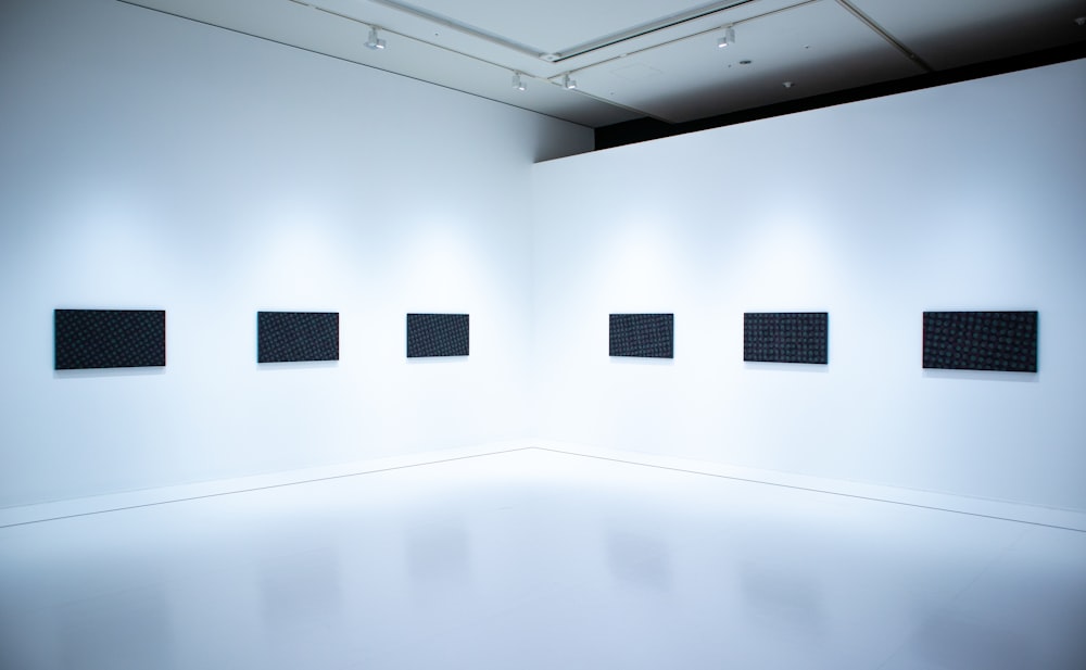 a white wall with black rectangular objects