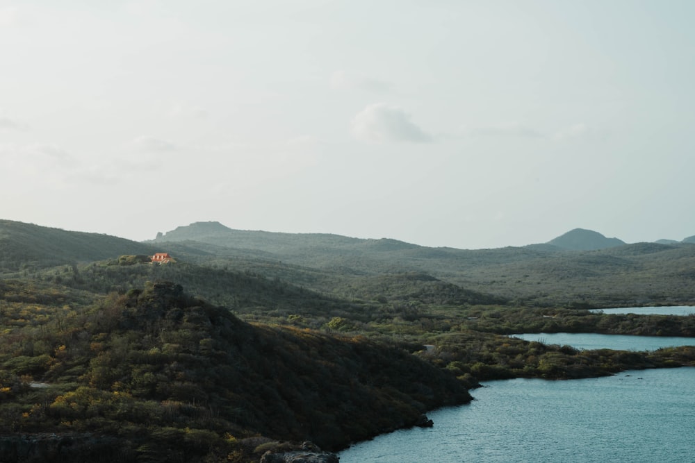 a body of water with hills around it