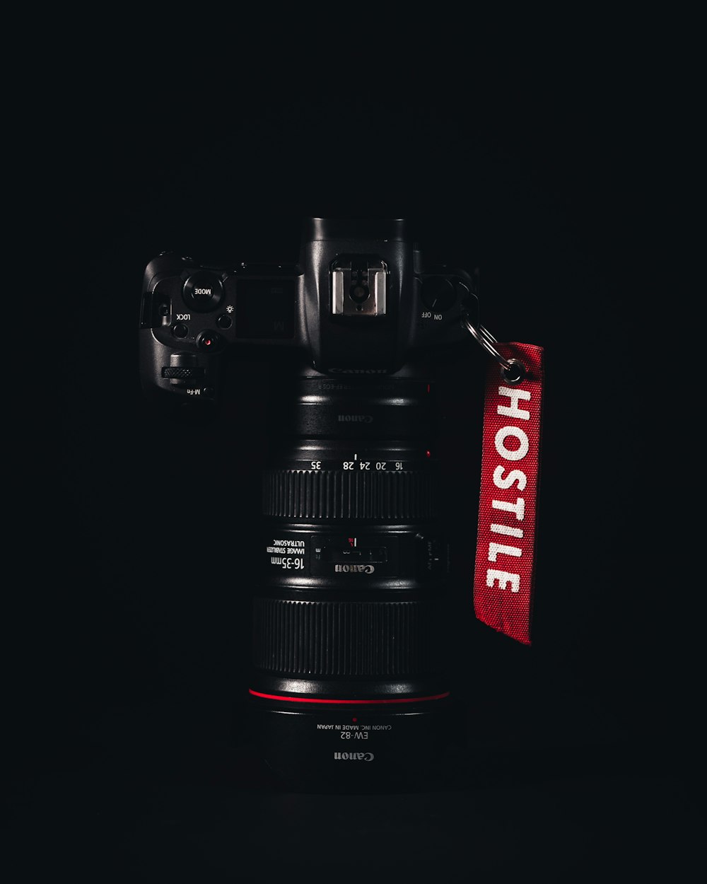 a black camera with a red label