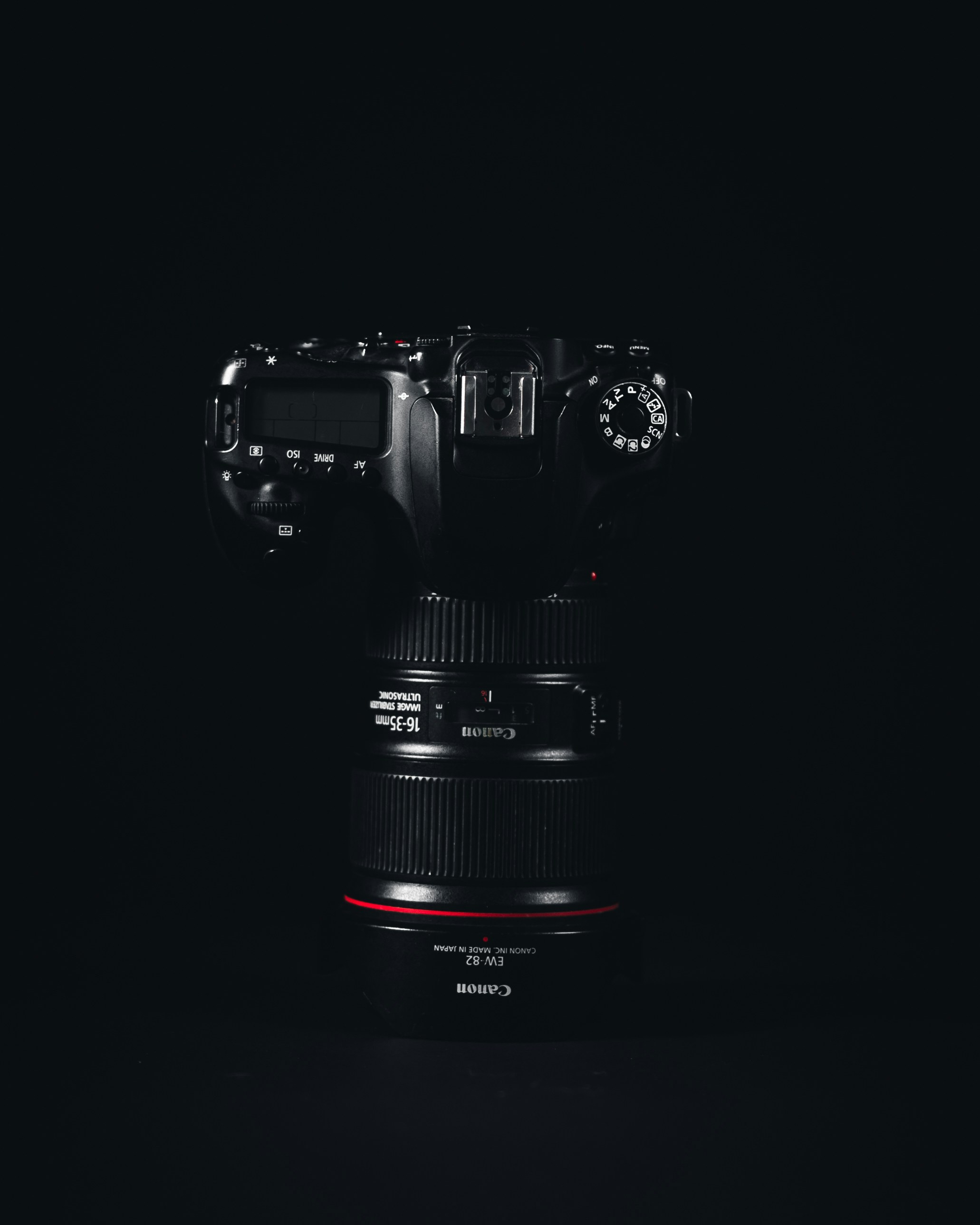 a black camera with red lights