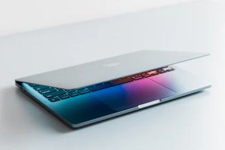a blue laptop with a black keyboard