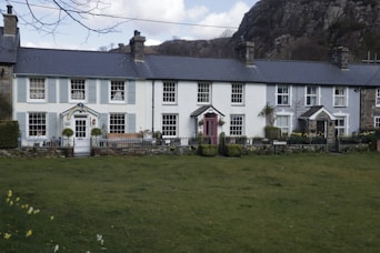 a large house with a lawn in front of it
