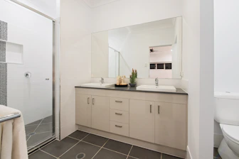 a room with a sink and a mirror