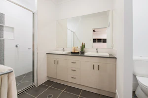 Modern renovated bathroom with sink and mirror