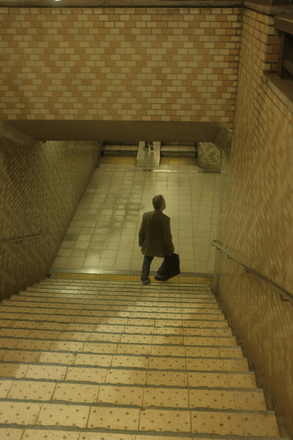 a person walking down a stone walkway