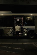 a man getting on a bus