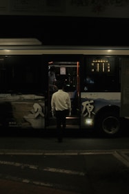 a man getting on a bus