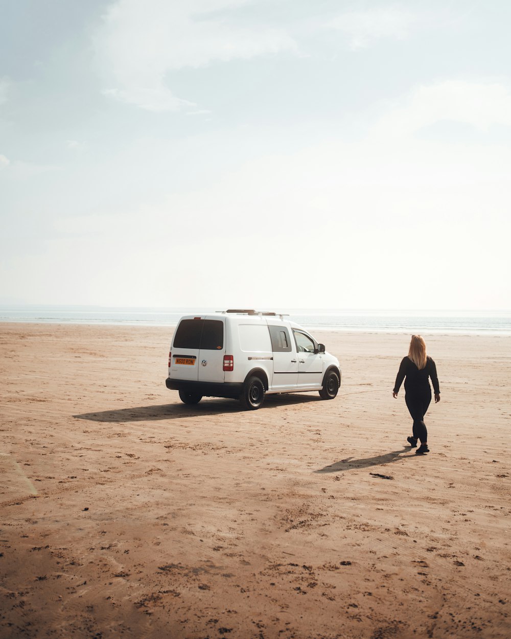 a man walking on a beach