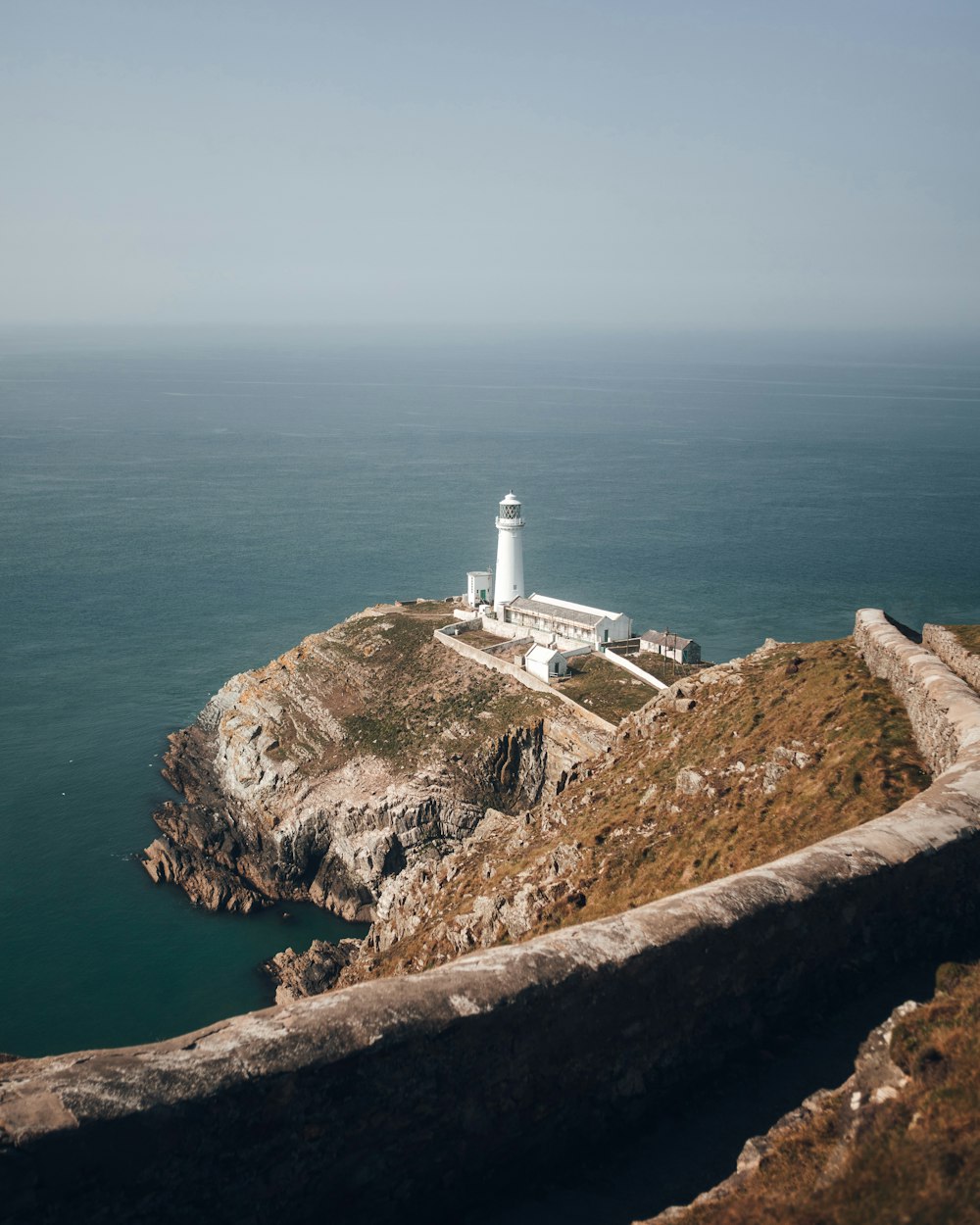 a lighthouse on a rocky cliff