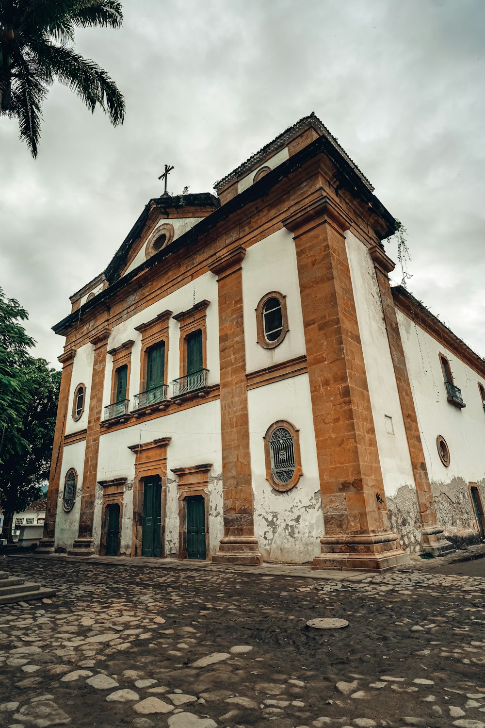 a white building with a cross on top