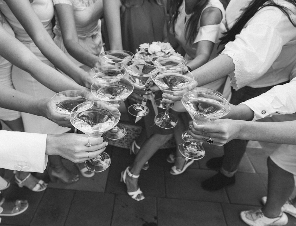 a group of people holding glasses