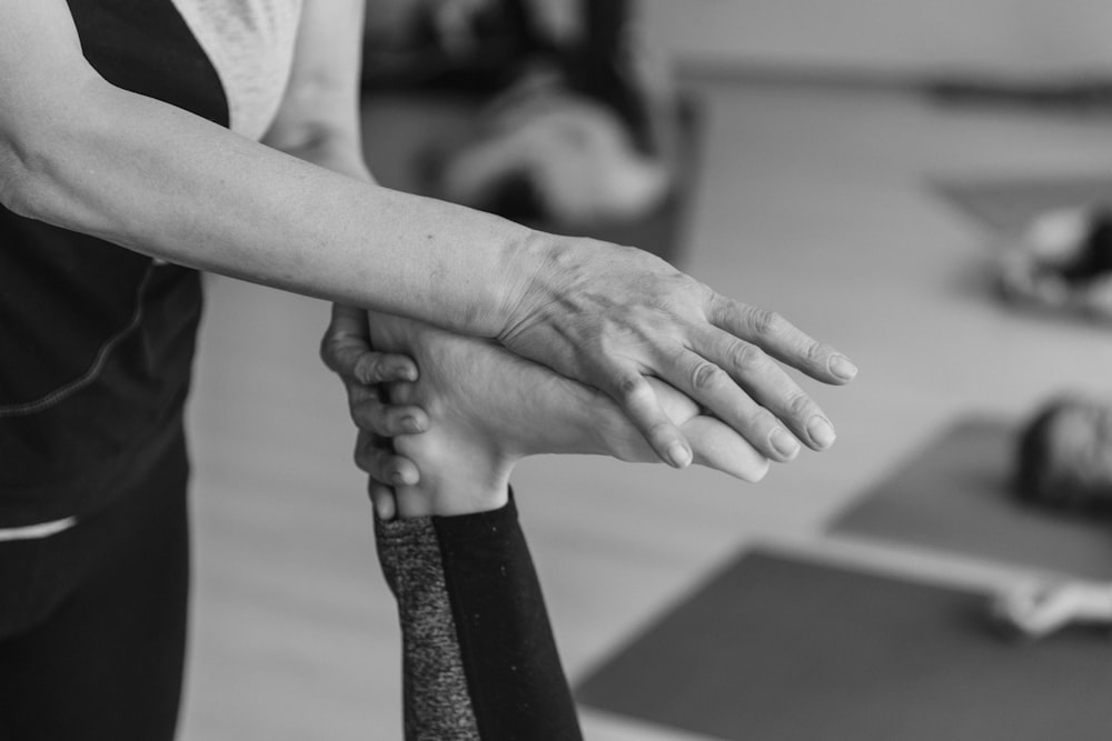 a close-up of a person's hands shaking