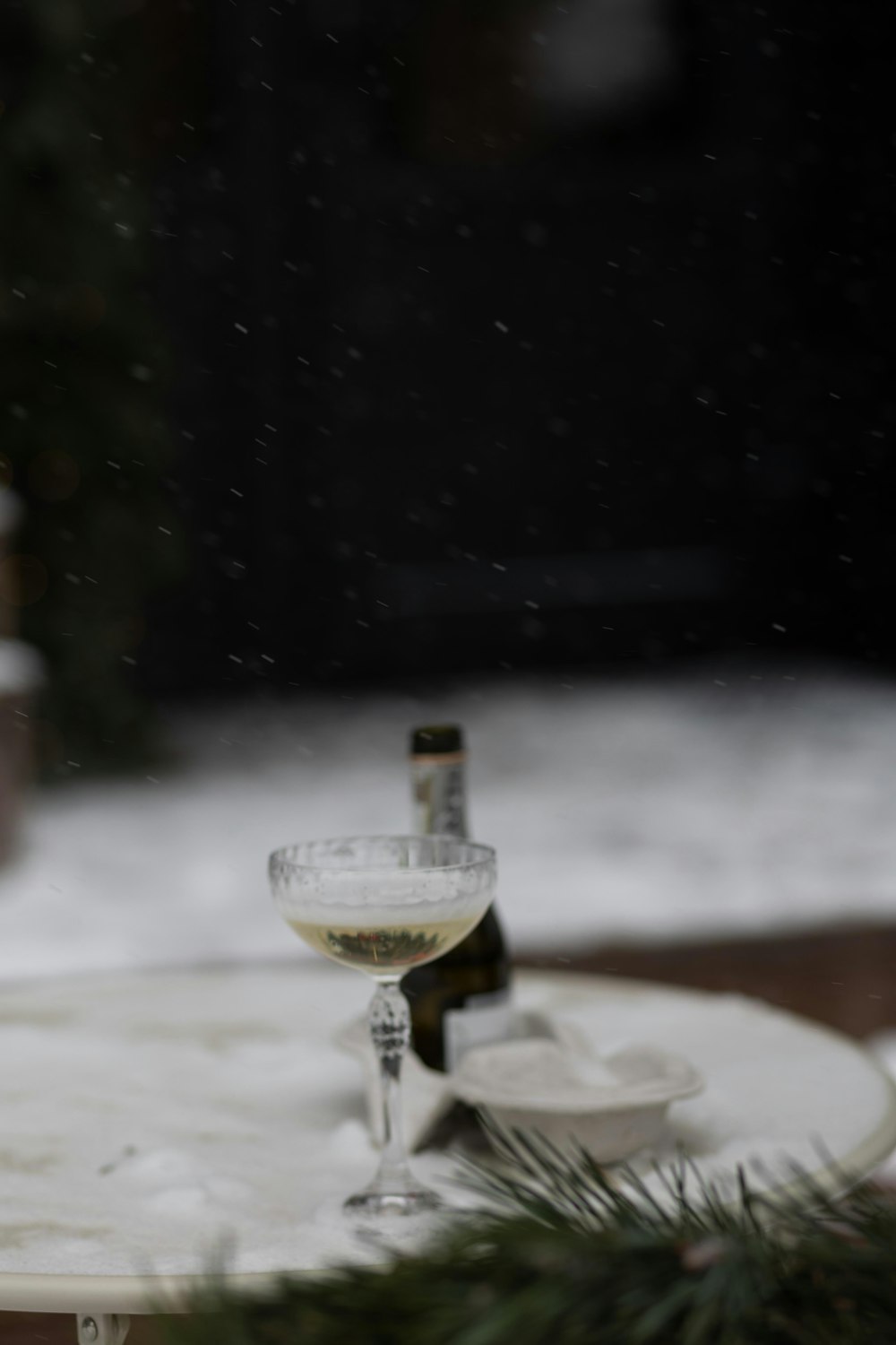 a glass of wine on a table