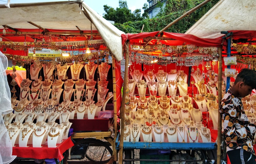 a person standing next to a stall