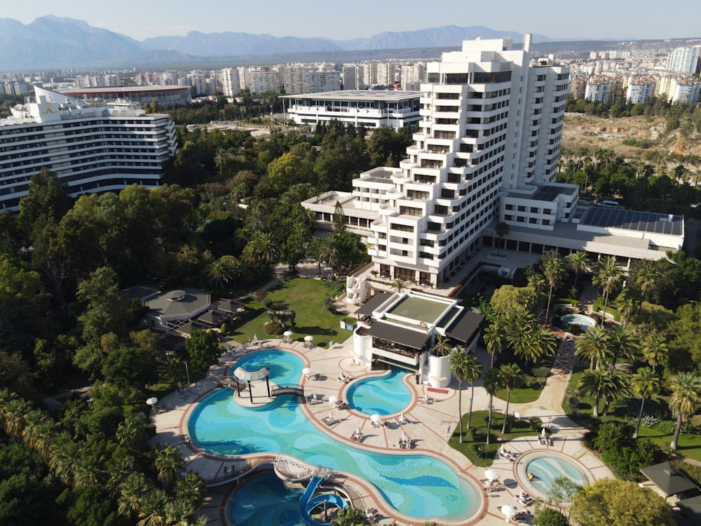 a large building with a pool in front of it