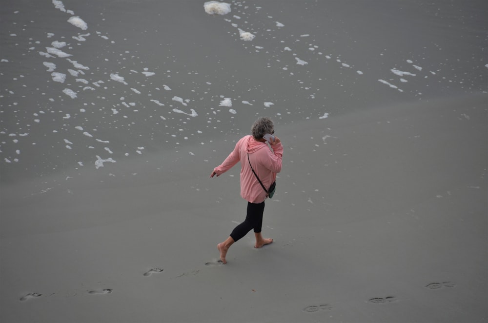 a person walking on a beach