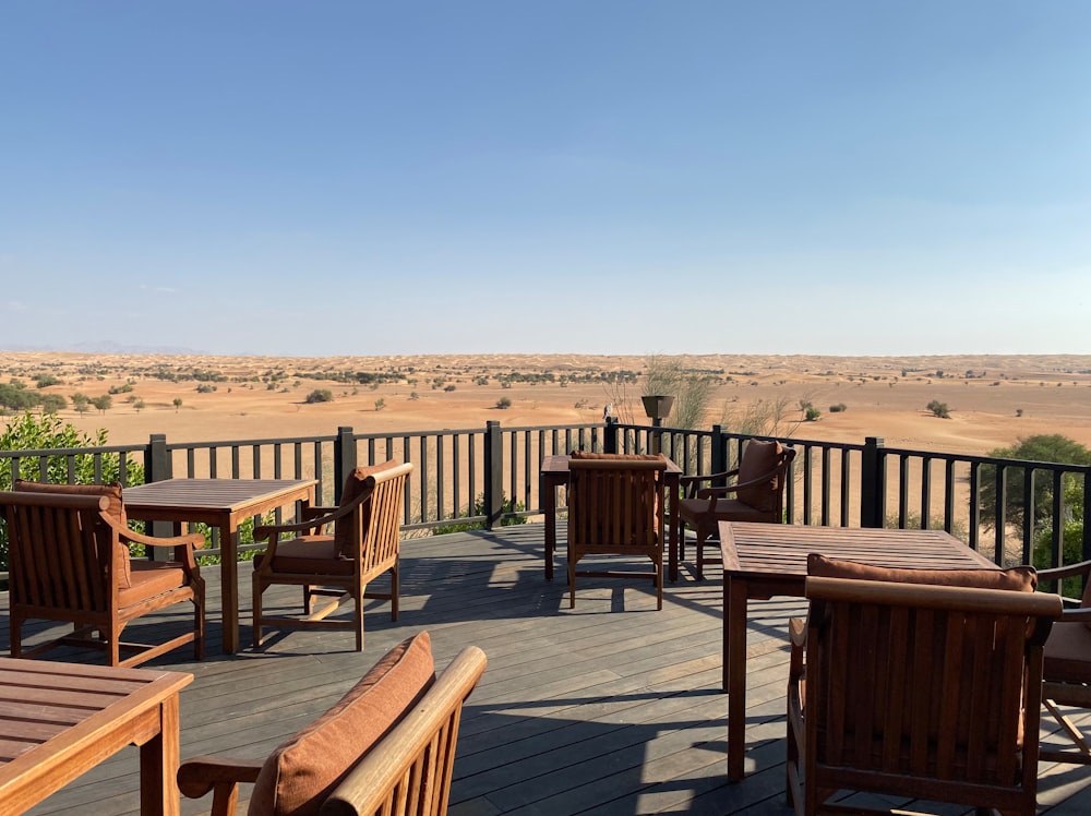 a deck with tables and chairs