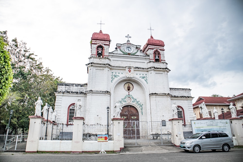 a white building with a red roof