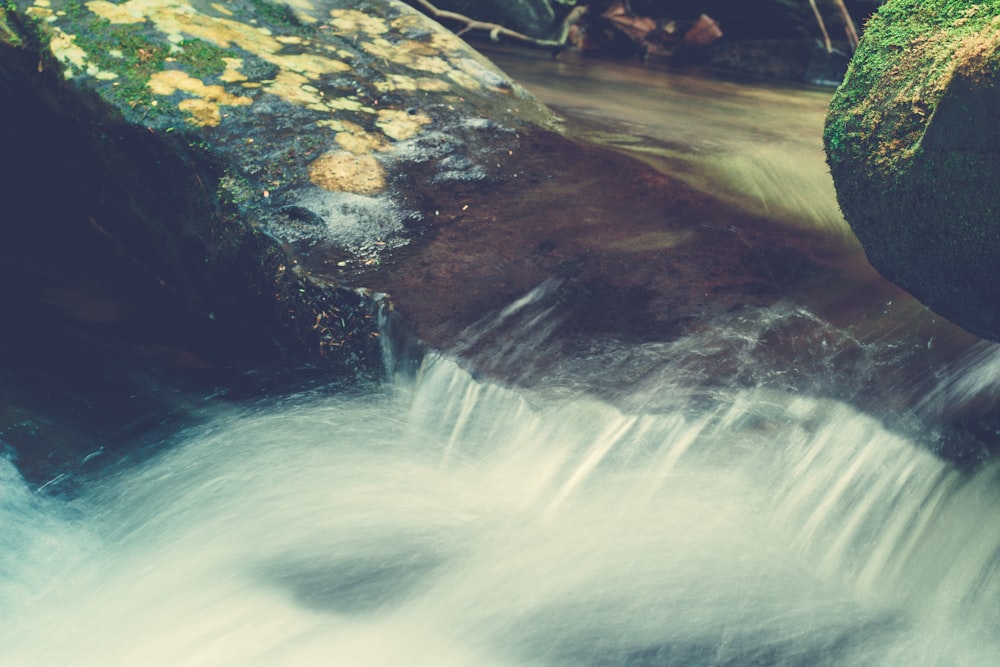 a waterfall with rocks