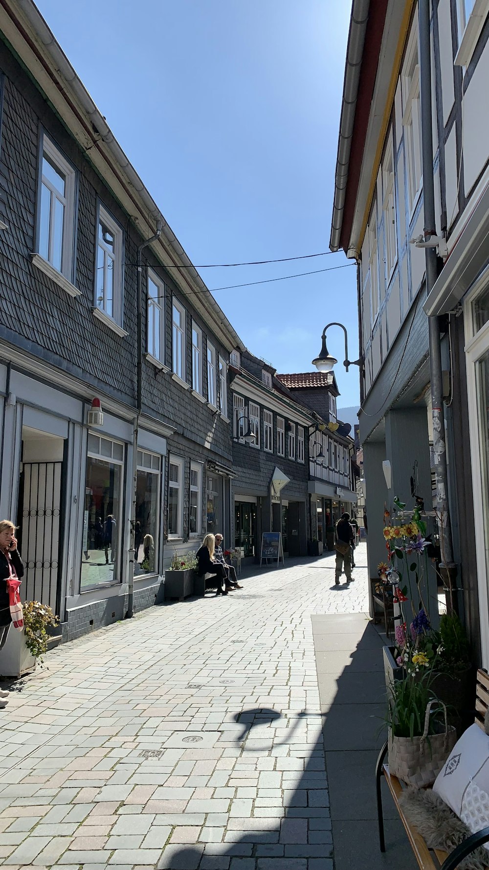 a cobblestone street between buildings