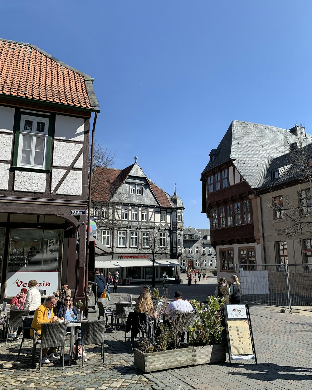 a group of people sitting outside of a building