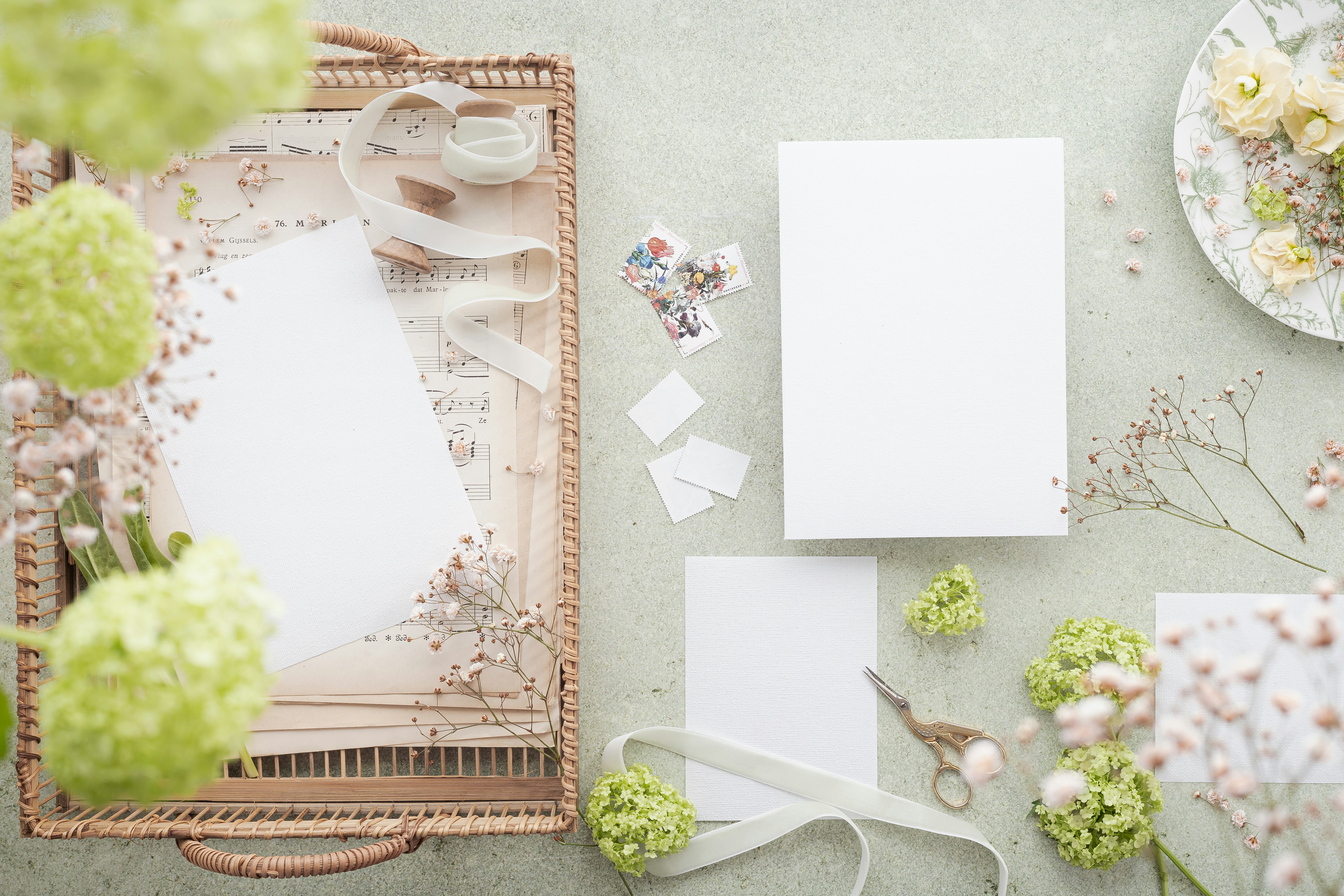 a table with a white board and white pieces of paper on it