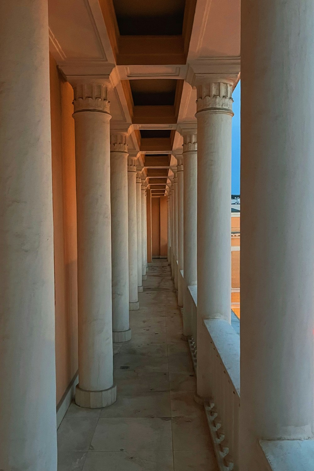 a hallway with pillars