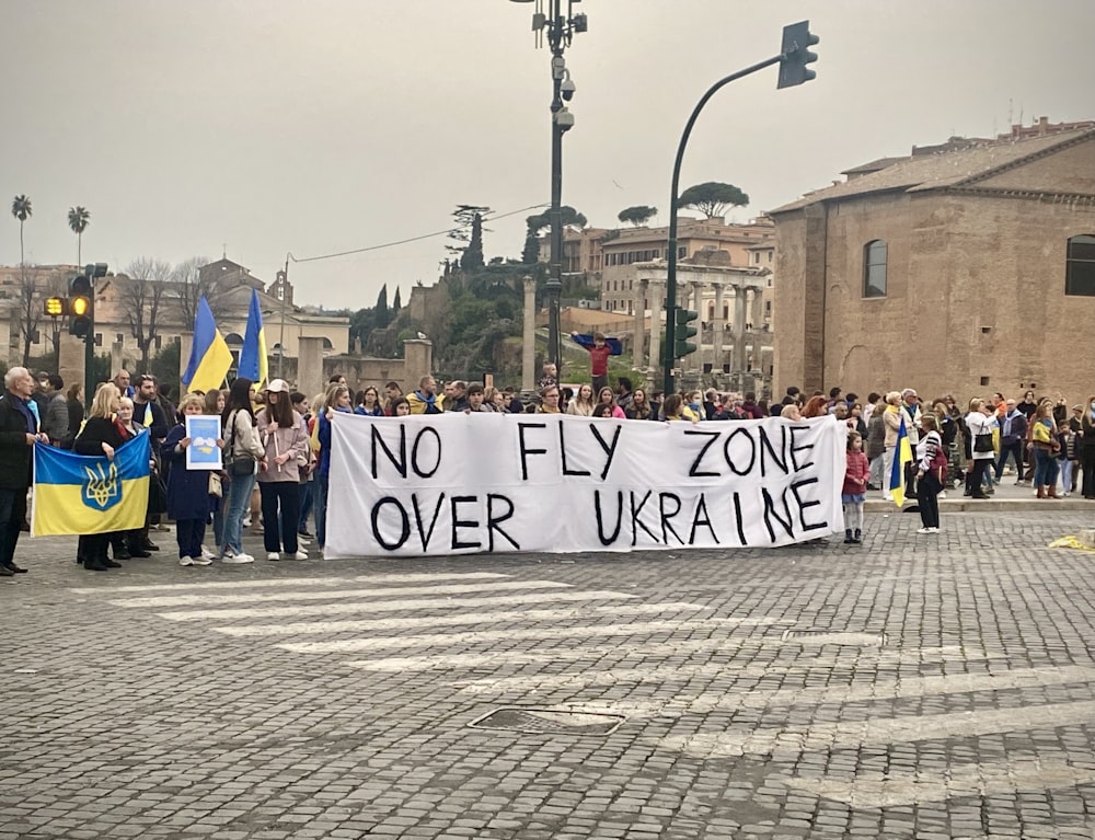 a group of people holding a sign