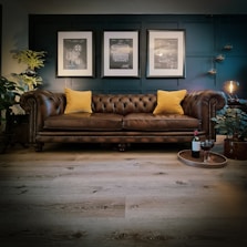 a couch with yellow pillows