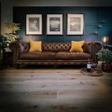 a couch with yellow pillows