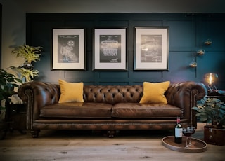 a couch with yellow pillows