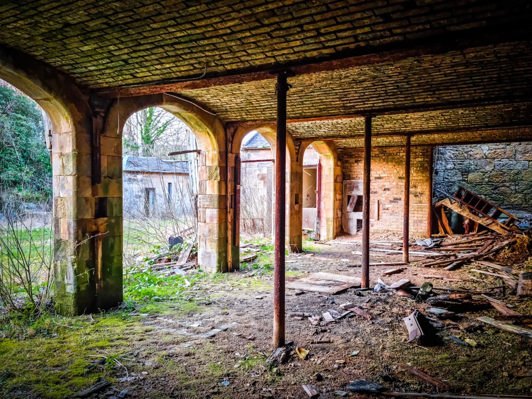 a building with broken windows, Dalquhaan Castle stable ruins