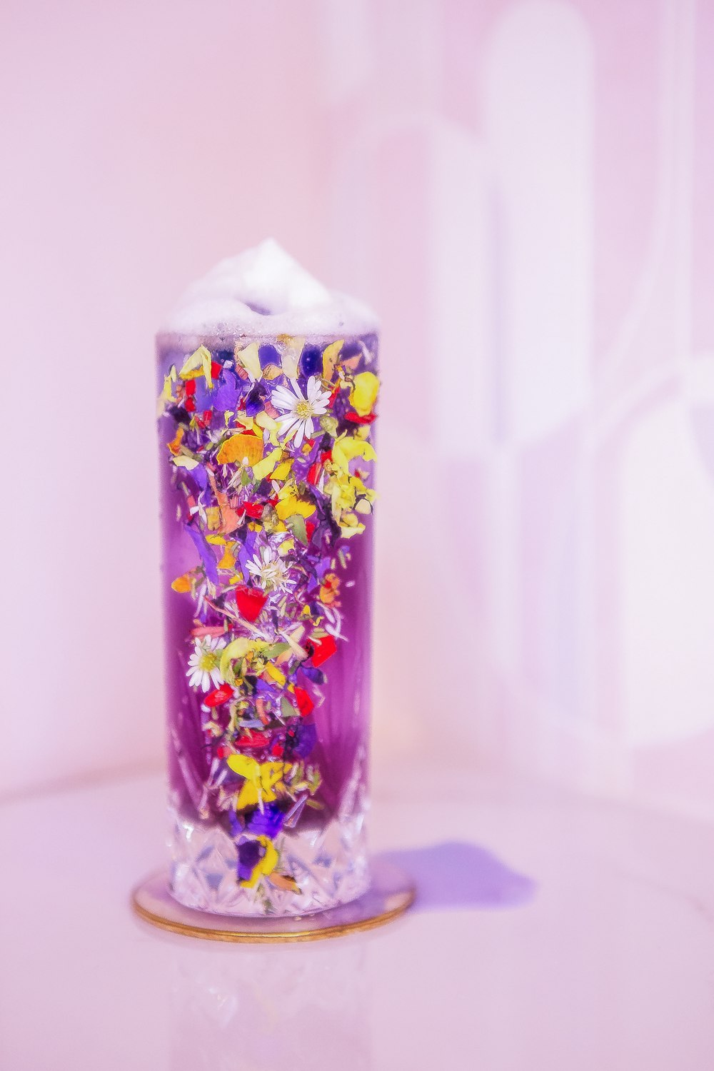 a glass vase with colorful flowers