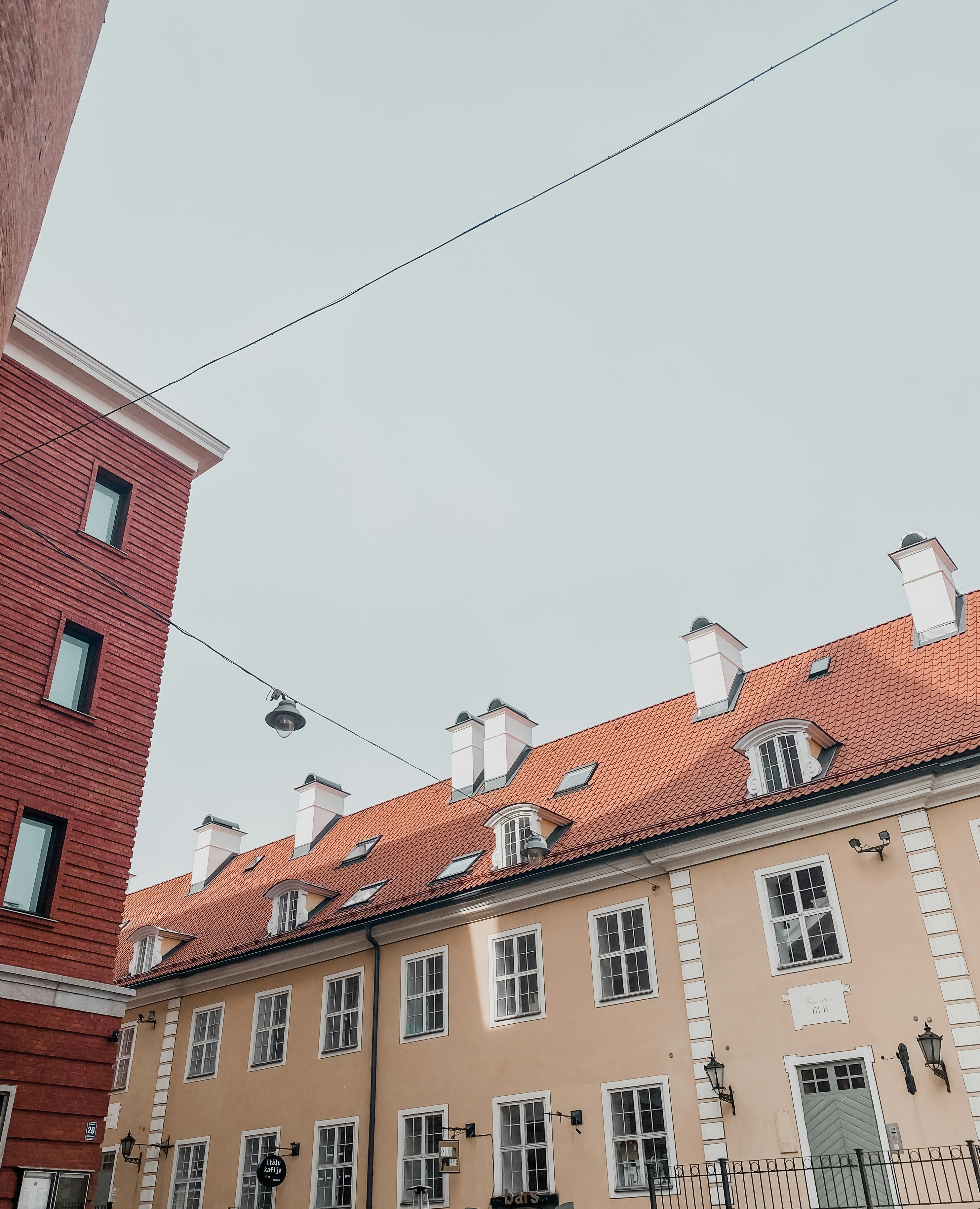A building with a wire fence photo – Free Riga Image on Unsplash