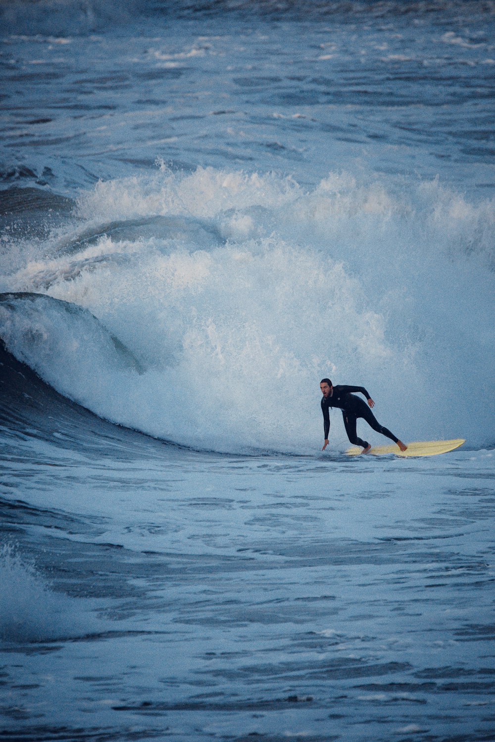 a man surfing on the waves