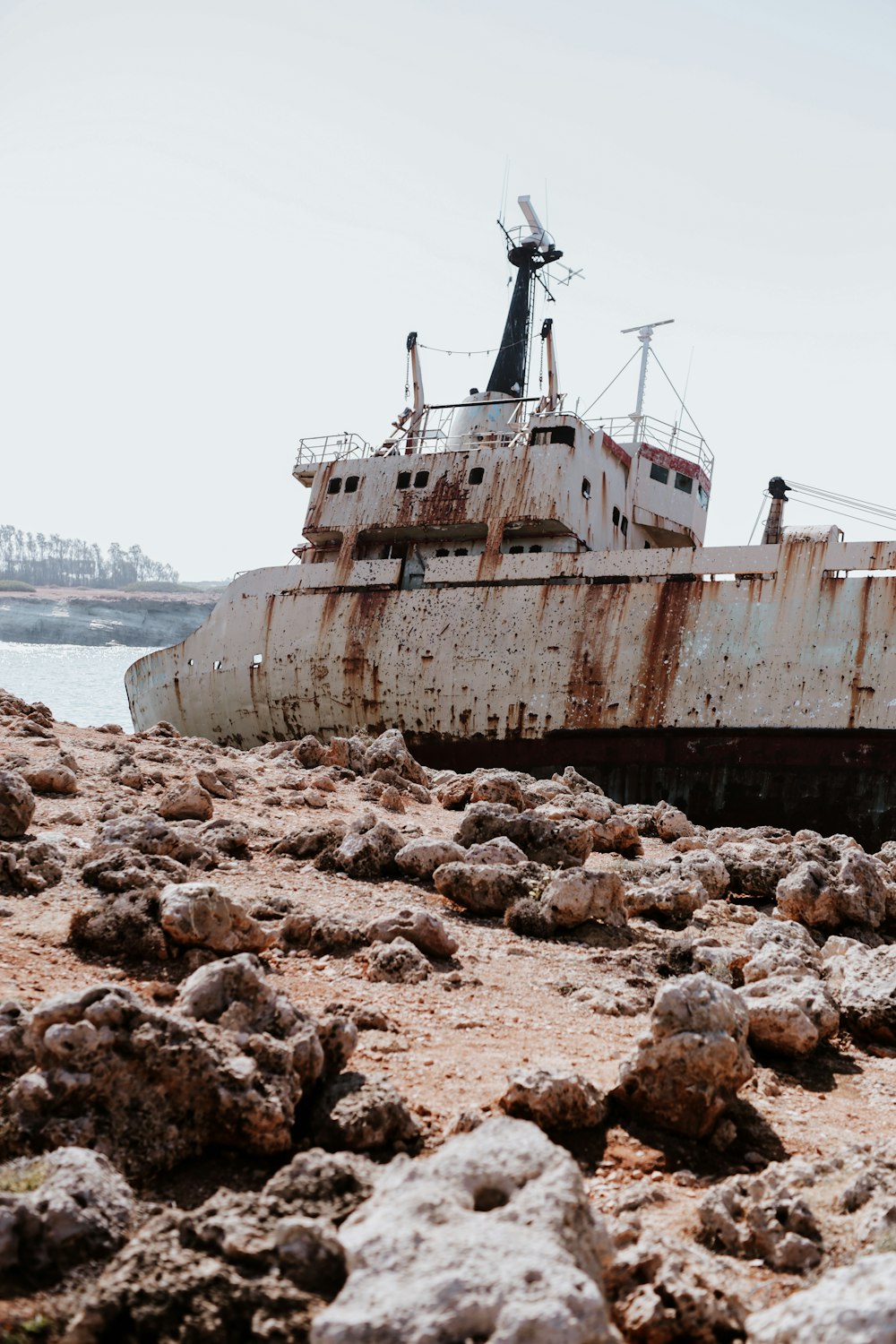 a boat on a rocky beach