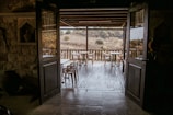 Rustic wooden door opening to a private terrace.