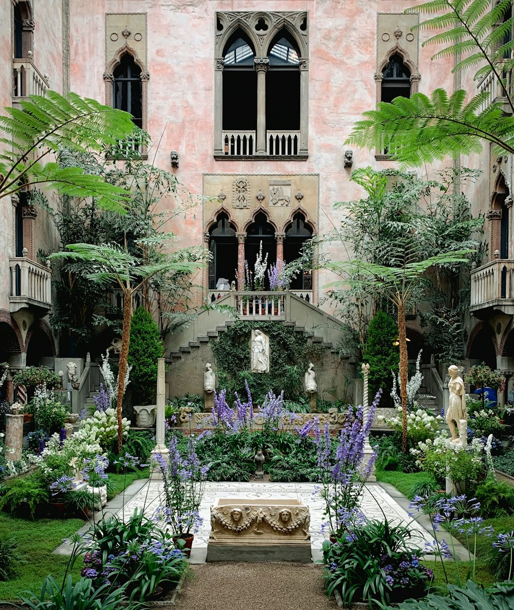 a large building with a fountain in front of it with Isabella Stewart Gardner Museum in the background