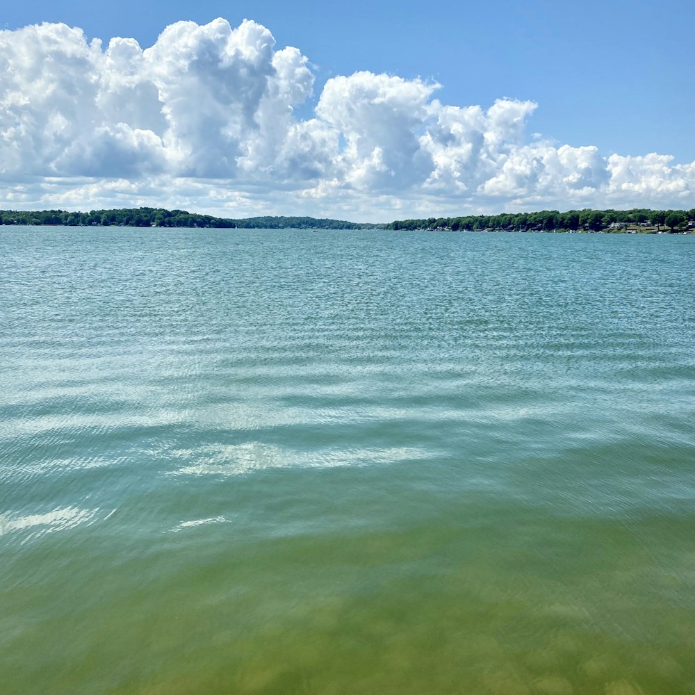 a body of water with land in the distance