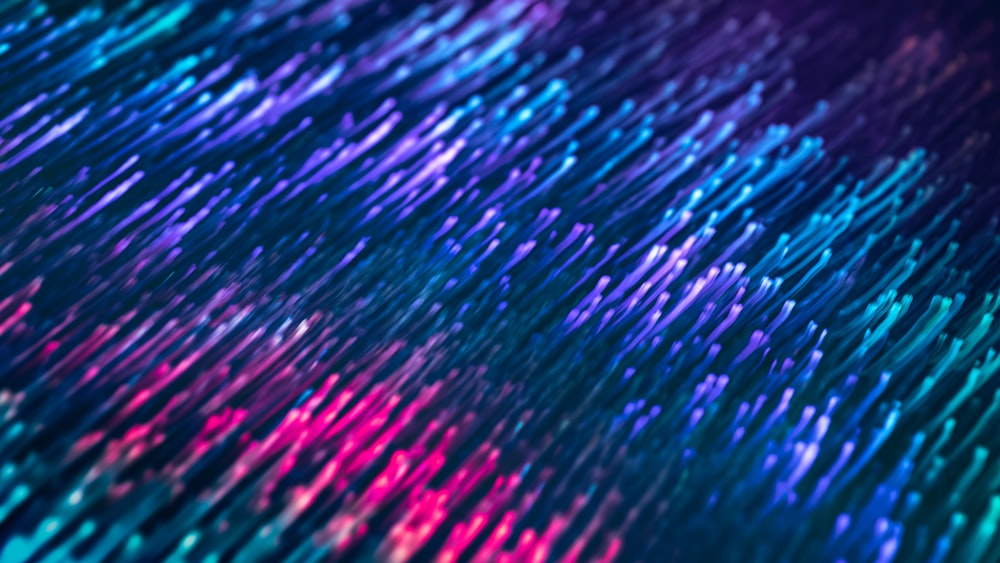 a close up of a blue and pink background